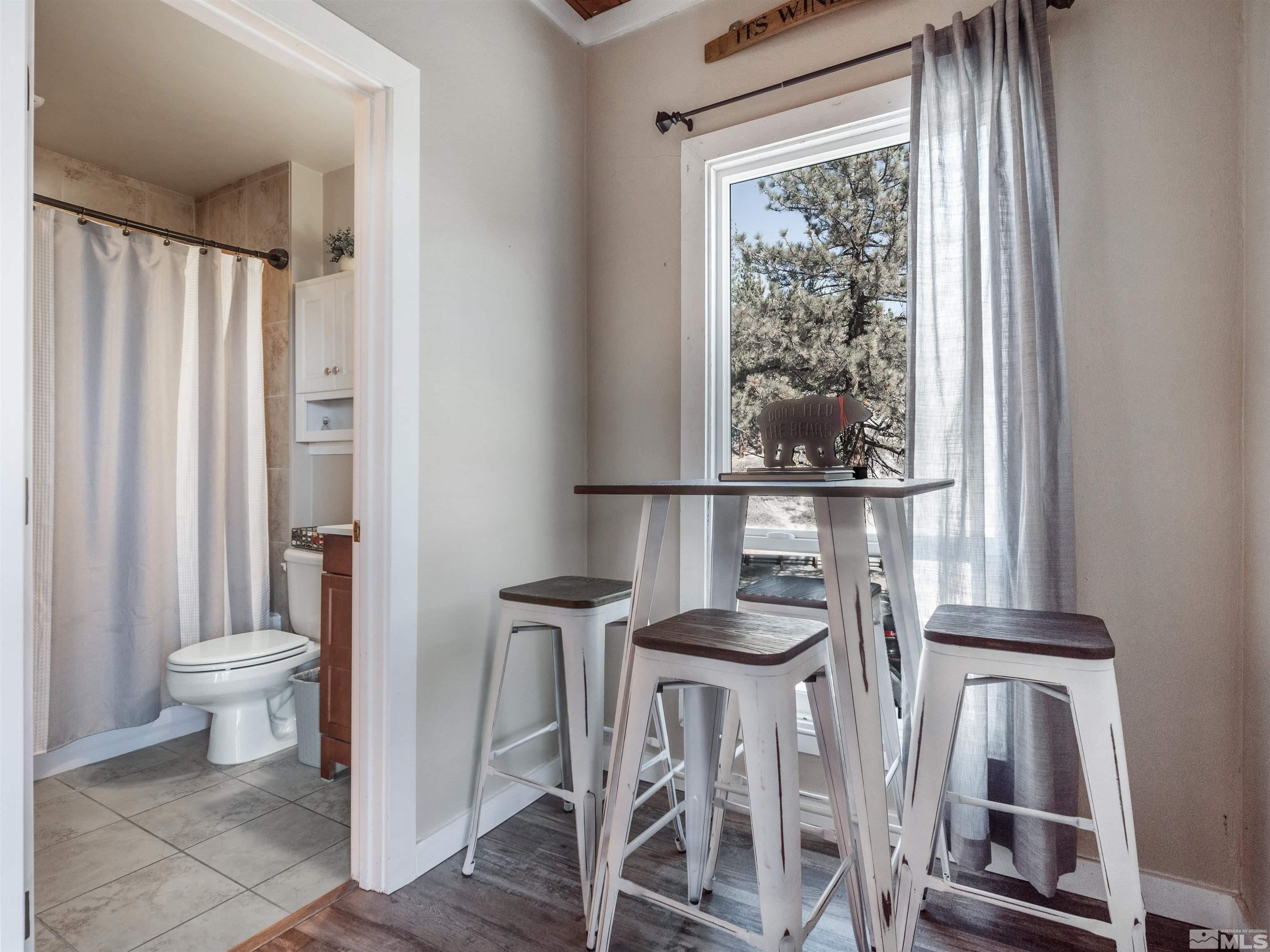 111 Tramway Drive, Unit 2 Stateline, NV 89449 - Photo 11 of 37 a bathroom with a toilet a sink and a window
