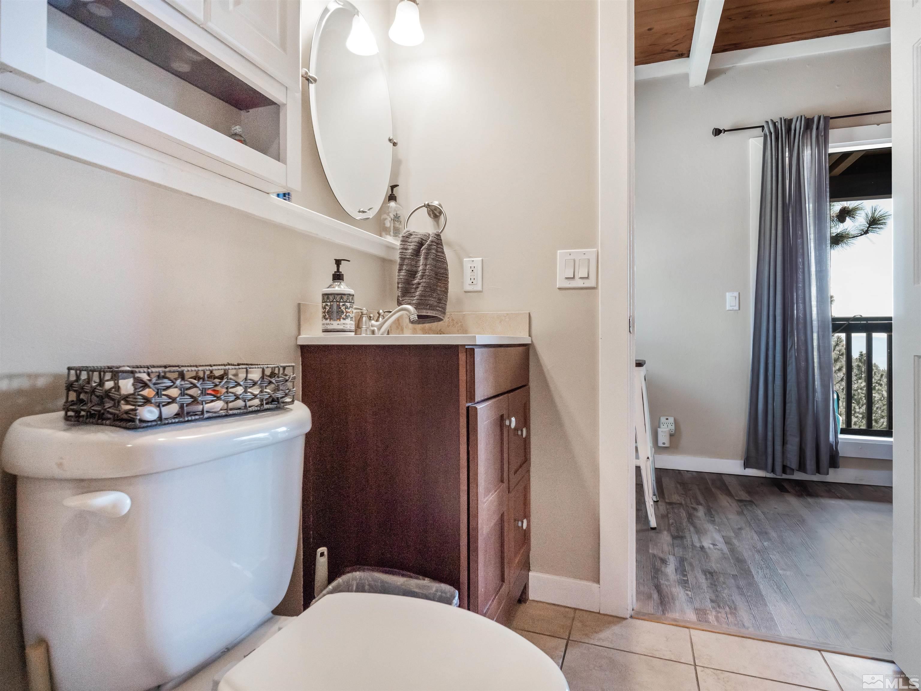 111 Tramway Drive, Unit 2 Stateline, NV 89449 - Photo 19 of 37 a bathroom with a sink a toilet and shower