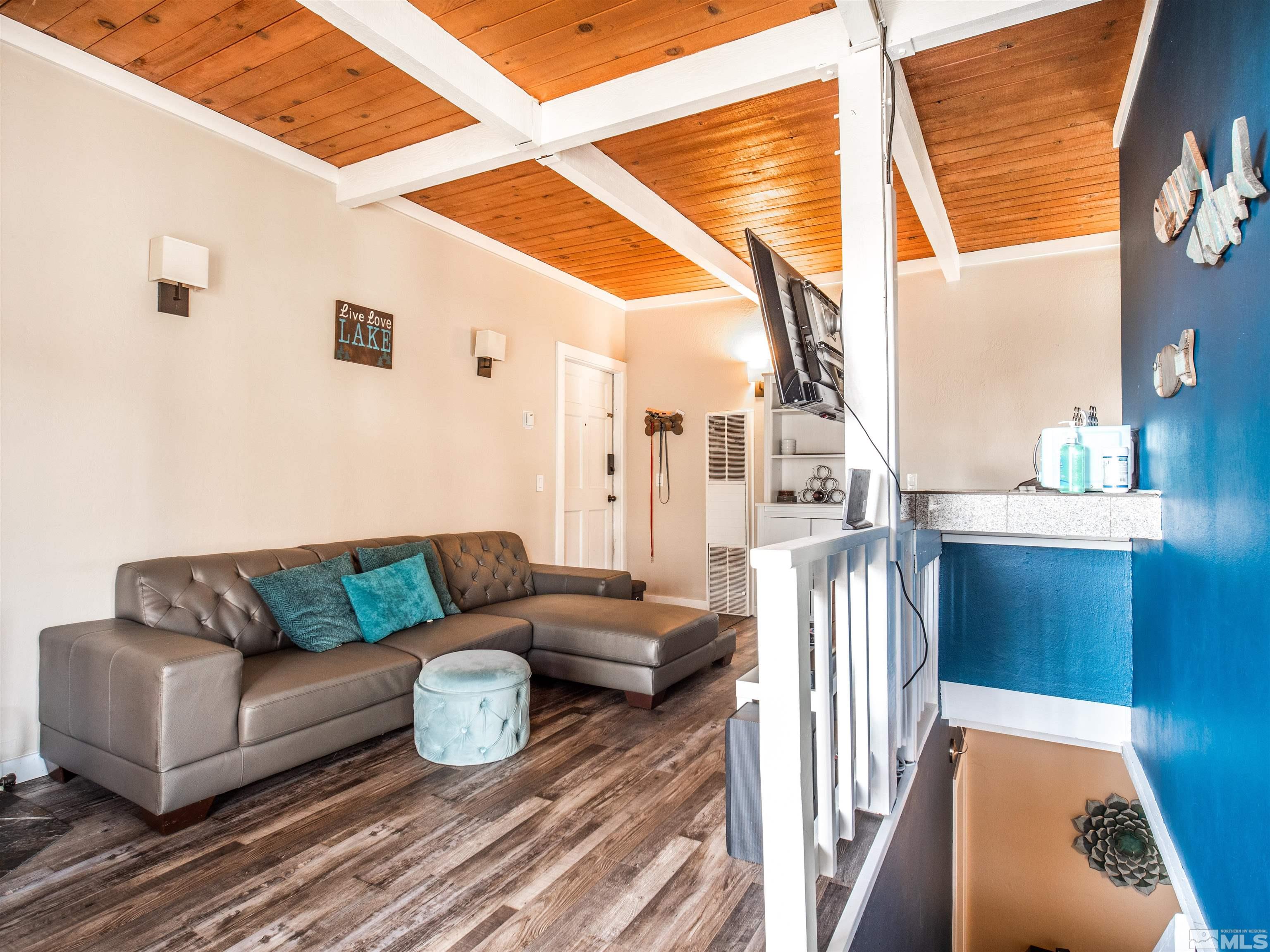 111 Tramway Drive, Unit 2 Stateline, NV 89449 - Photo 7 of 37 a living room with furniture and a window