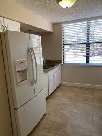 a utility room with window dryer and washer