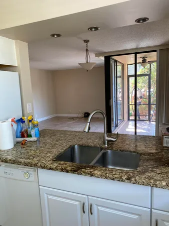 a kitchen with sink a window and appliances