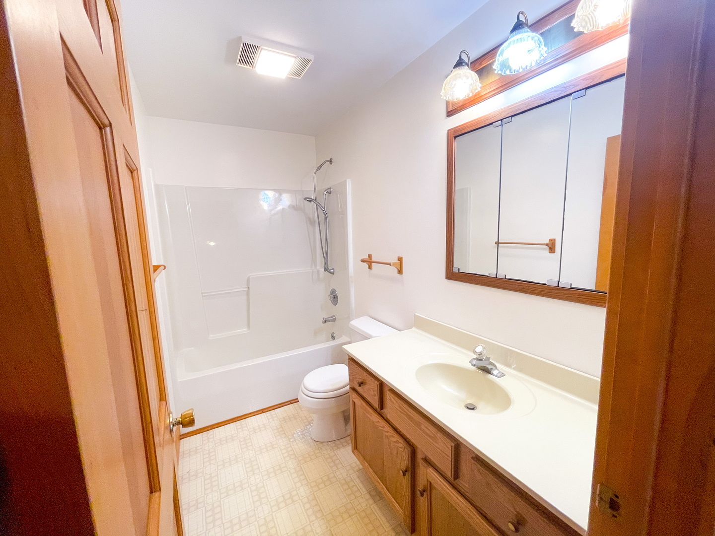 -n575 Pouley Road Elburn, IL 60119 - Photo 14 of 27 a bathroom with a sink a toilet a mirror and shower