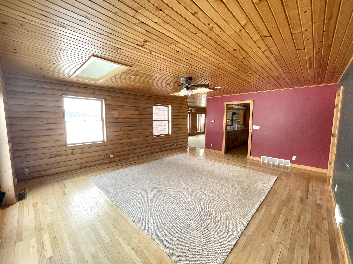 -n575 Pouley Road Elburn, IL 60119 - Photo 7 of 27 a view of a livingroom with wooden floor and large window