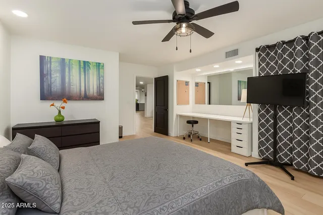 a bedroom with furniture and a bed