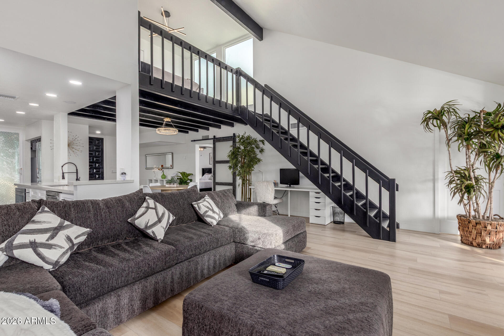 2529 North Miller Road Scottsdale, AZ 85257 - Photo 15 of 65 a living room with furniture or stairs and a wooden floor