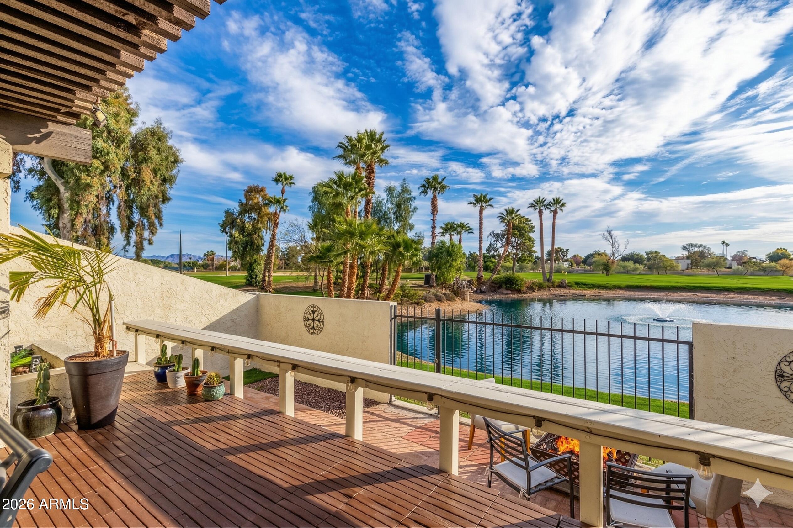 2529 North Miller Road Scottsdale, AZ 85257 - Photo 3 of 65 a view of a balcony with wooden floor and seating space
