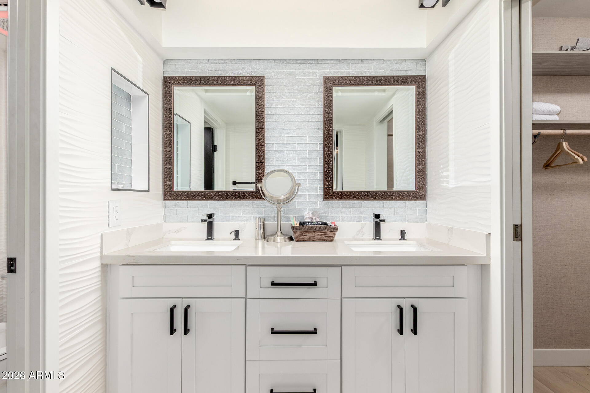 2529 North Miller Road Scottsdale, AZ 85257 - Photo 34 of 65 a bathroom with double sink and a mirror