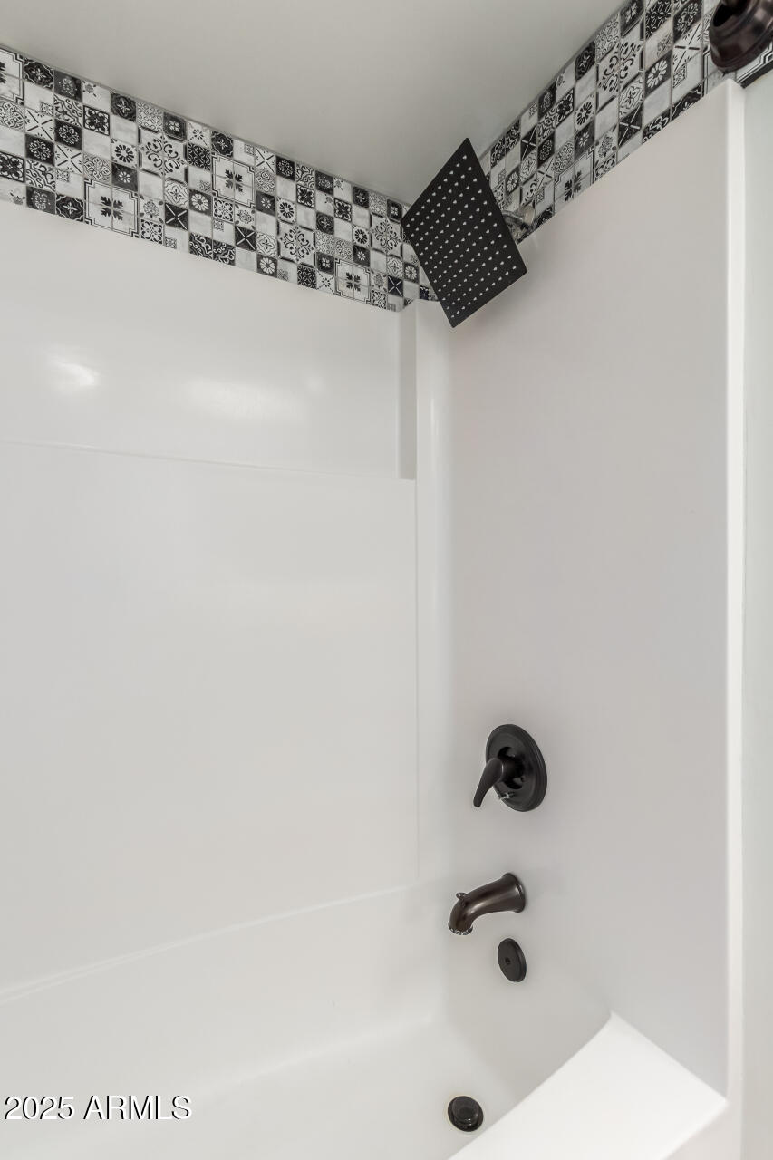 2529 North Miller Road Scottsdale, AZ 85257 - Photo 43 of 65 a bathroom with a shower