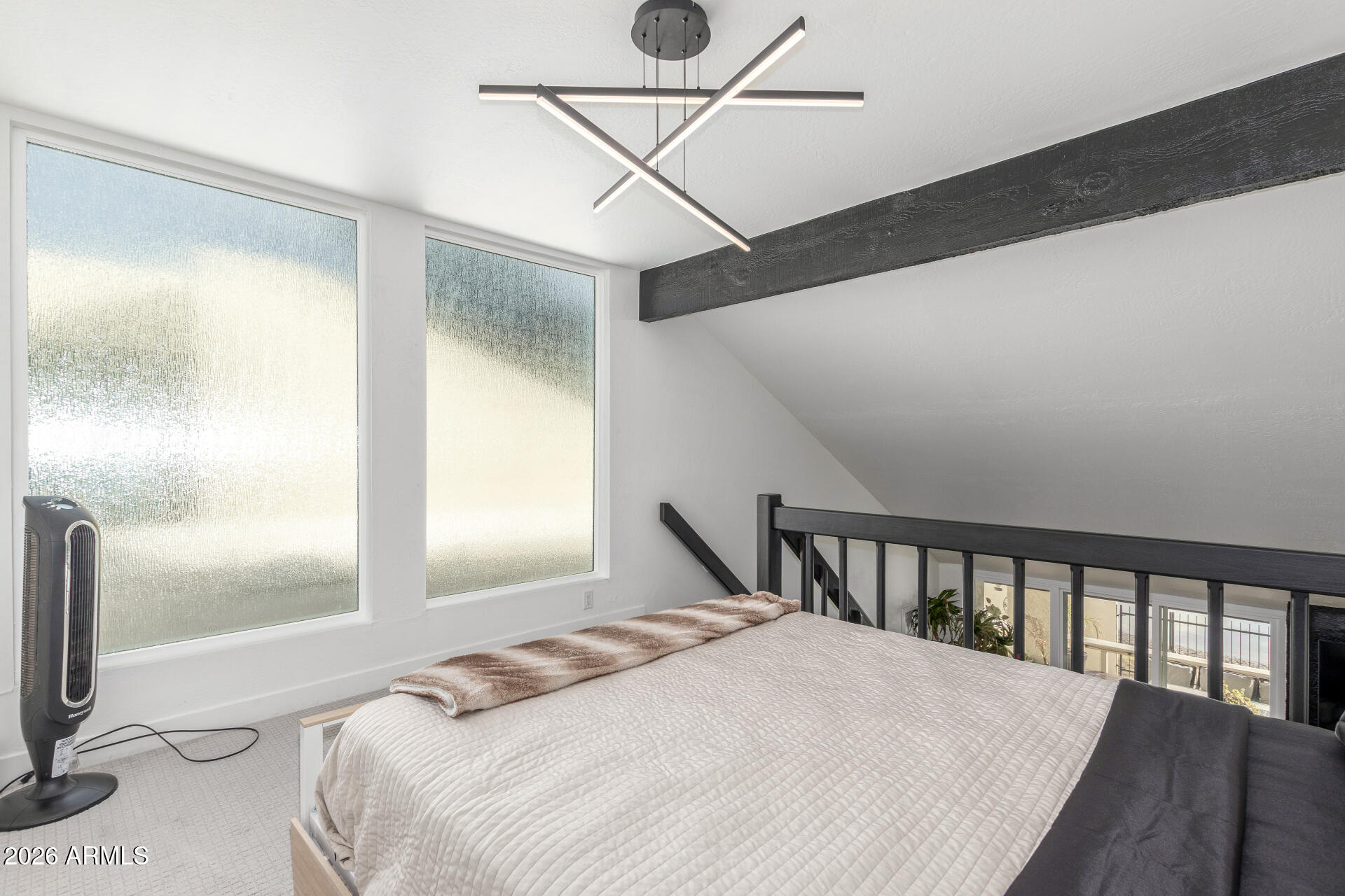 2529 North Miller Road Scottsdale, AZ 85257 - Photo 51 of 65 a bedroom with a bed next to a window