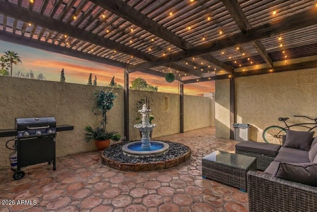 2529 North Miller Road Scottsdale, AZ 85257 - Photo 7 of 65 a living room with furniture and a chandelier