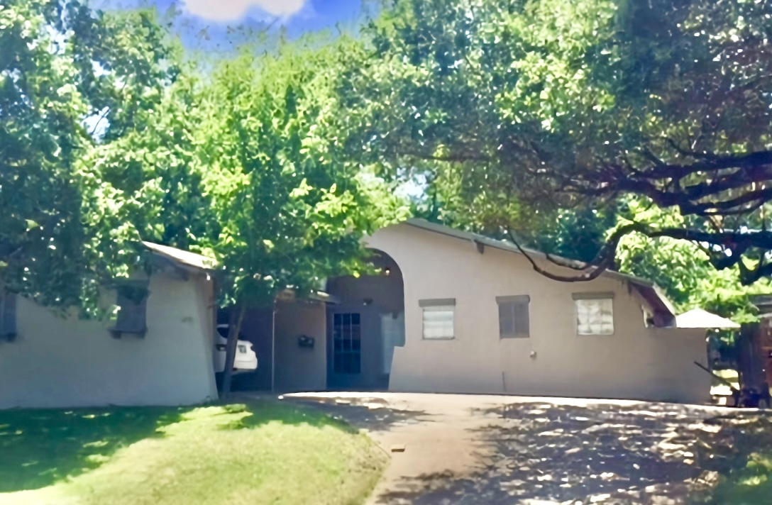 a house with trees in front of it