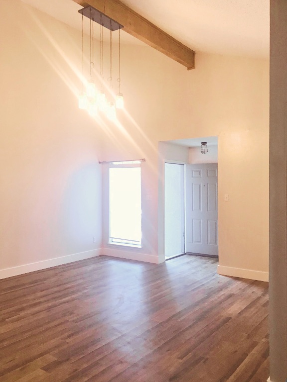 1415 Valleyridge Drive, Unit A Austin, TX 78704 - Photo 2 of 11 an empty room with wooden floor and windows