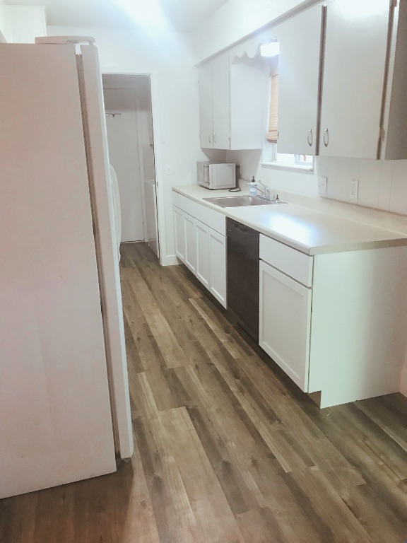 1415 Valleyridge Drive, Unit A Austin, TX 78704 - Photo 6 of 11 a view of a kitchen sink and a refrigerator