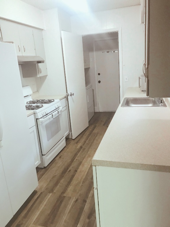 1415 Valleyridge Drive, Unit A Austin, TX 78704 - Photo 7 of 11 a room with a stove and a refrigerator