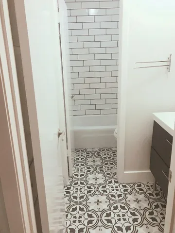 a bathroom with a sink and a shower