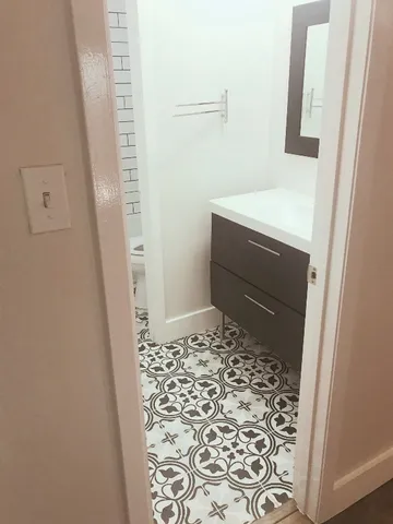 a bathroom with a sink and a mirror
