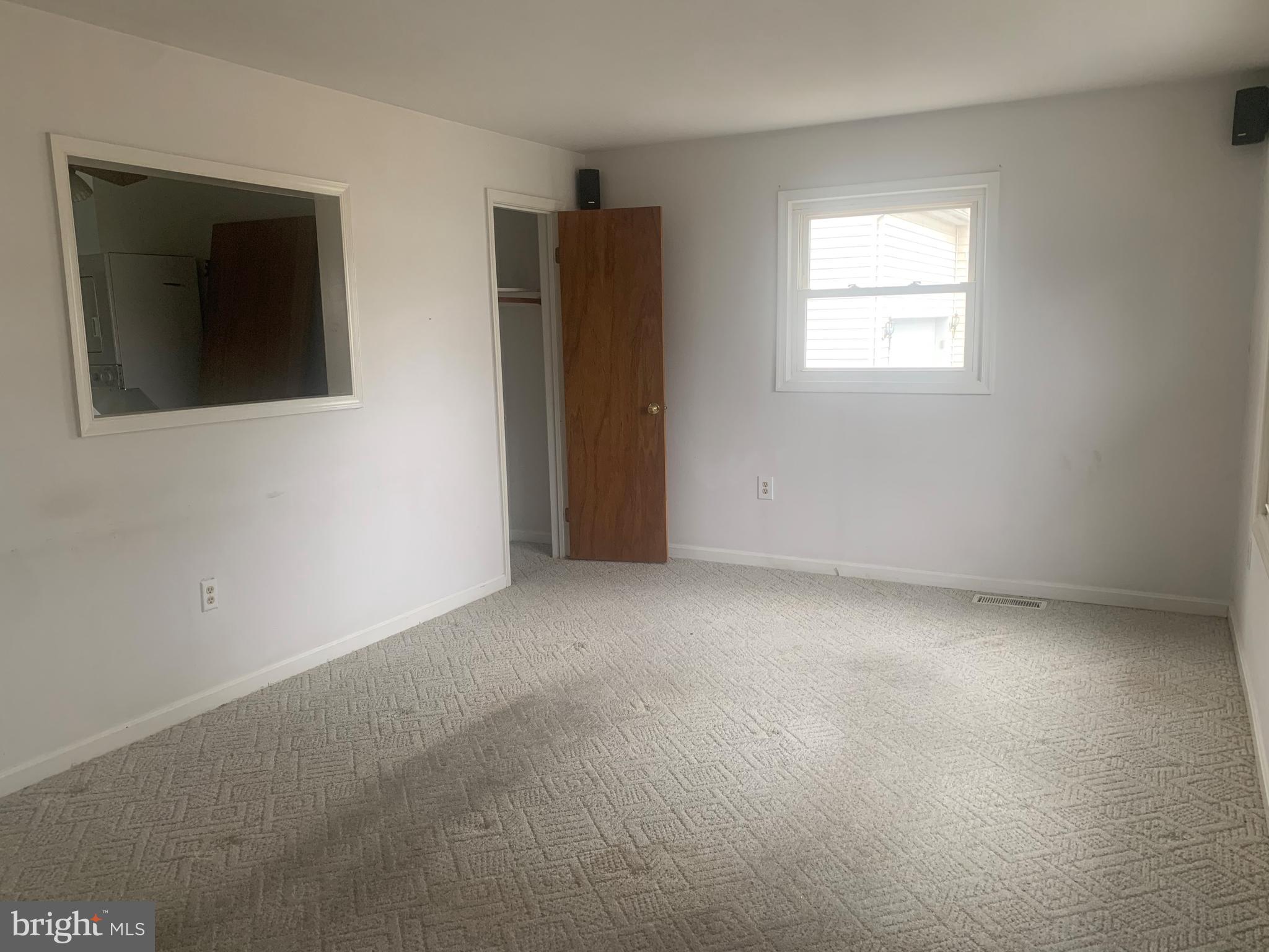5866 Deale Churchton Road Deale, MD 20751 - Photo 3 of 26 an empty room with windows and closet
