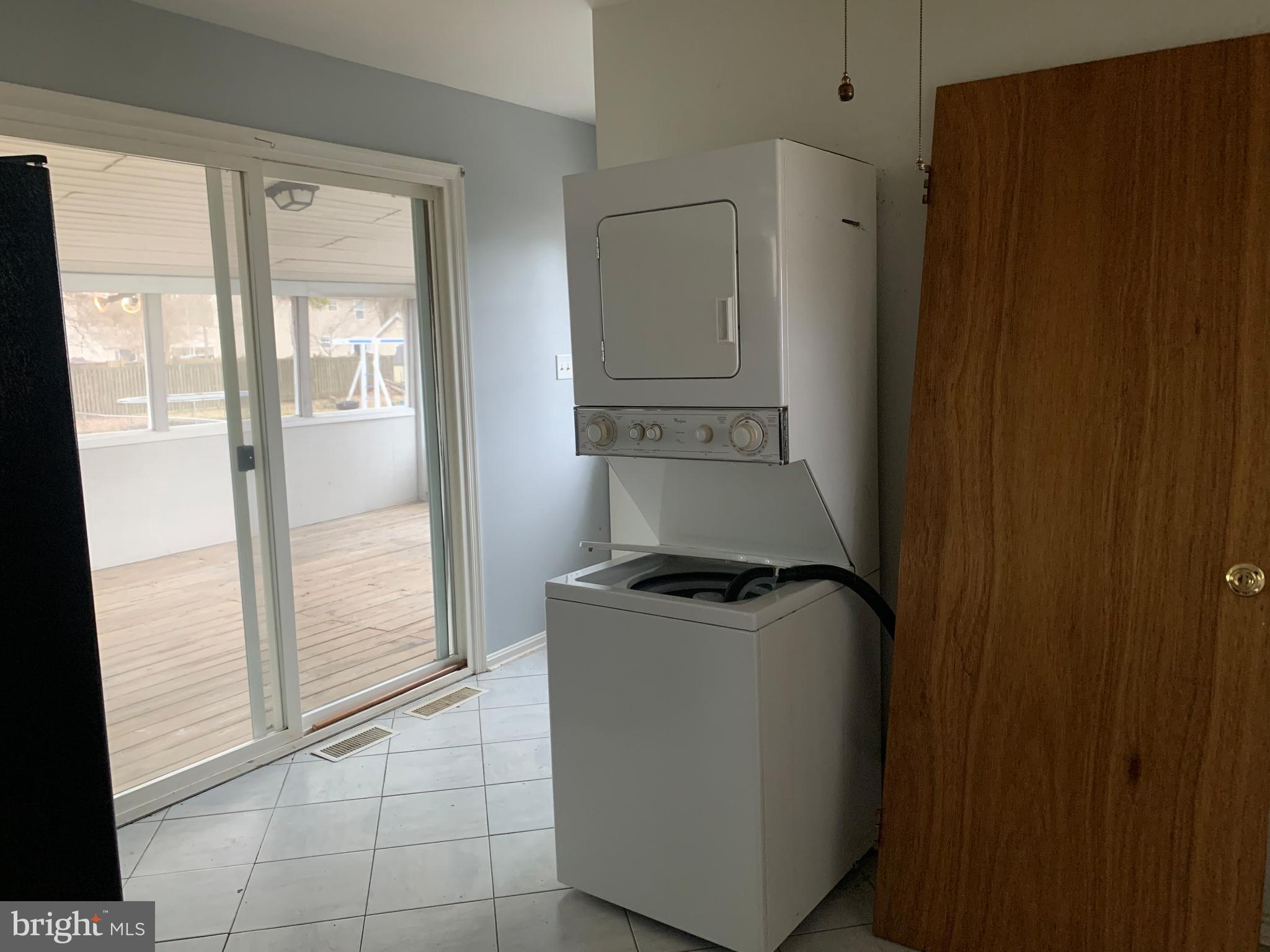 5866 Deale Churchton Road Deale, MD 20751 - Photo 26 of 26 a utility room with wooden floor washer and dryer
