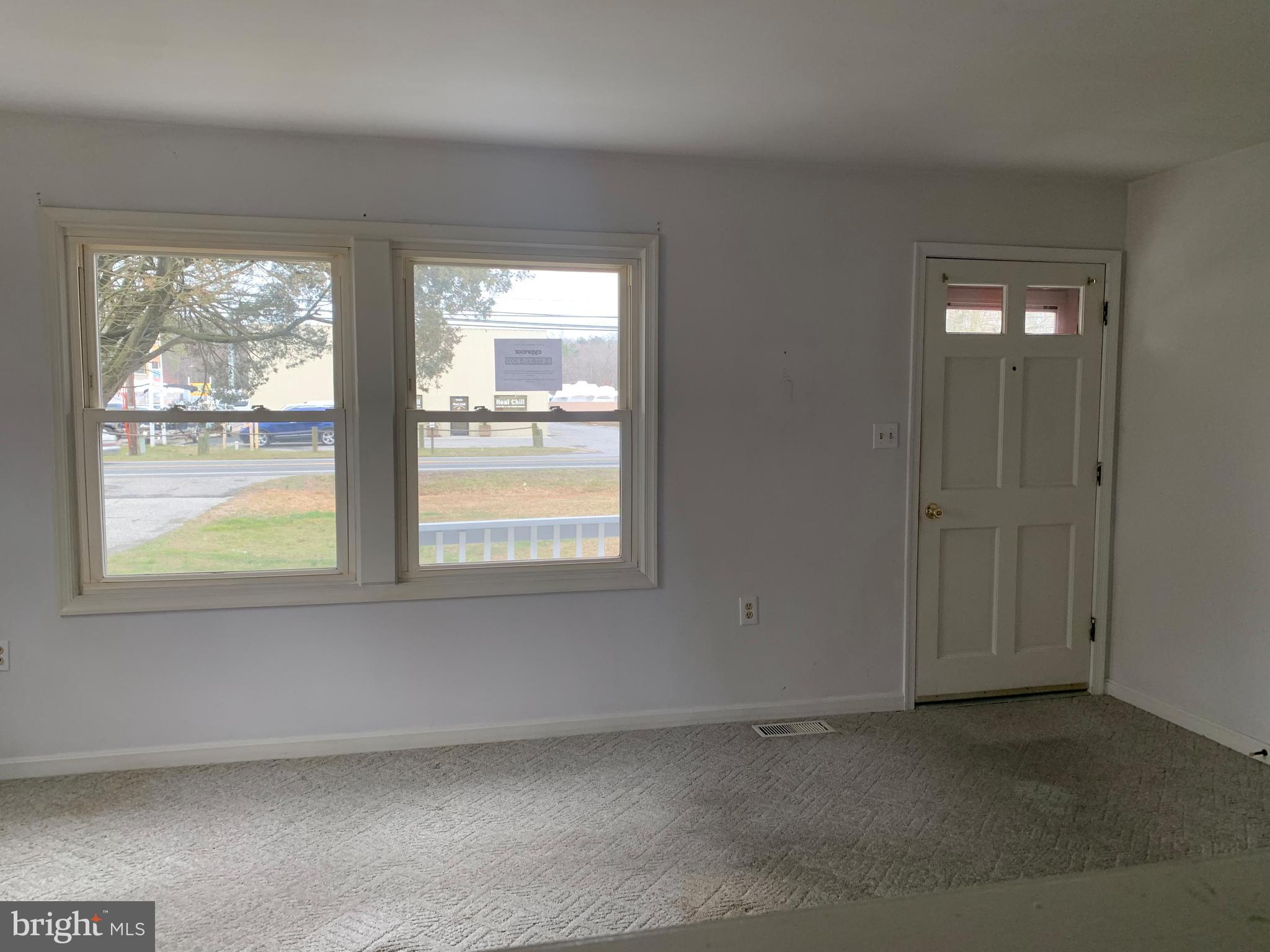 5866 Deale Churchton Road Deale, MD 20751 - Photo 5 of 26 an empty room with a window