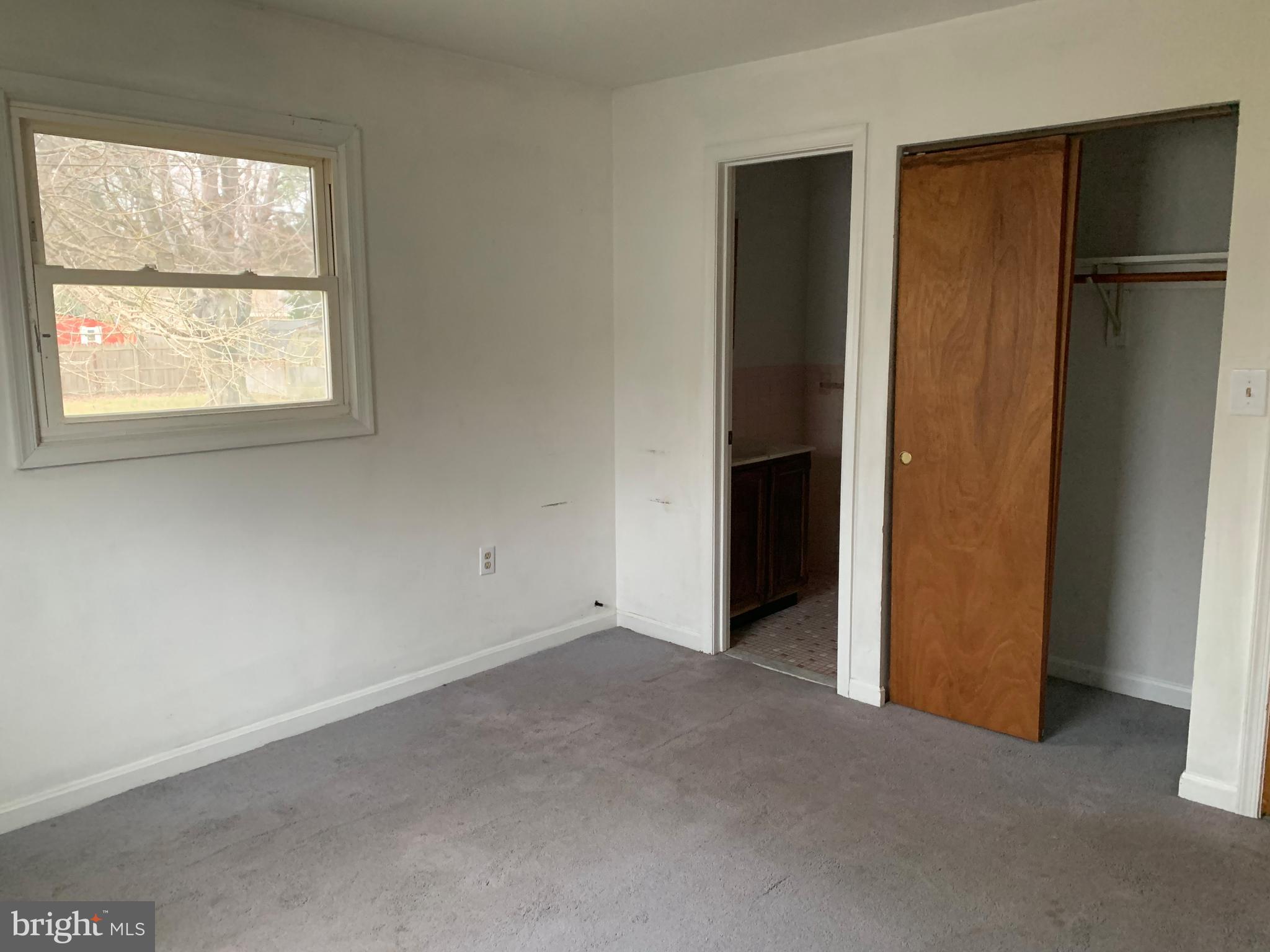 5866 Deale Churchton Road Deale, MD 20751 - Photo 7 of 26 an empty room with windows and closet