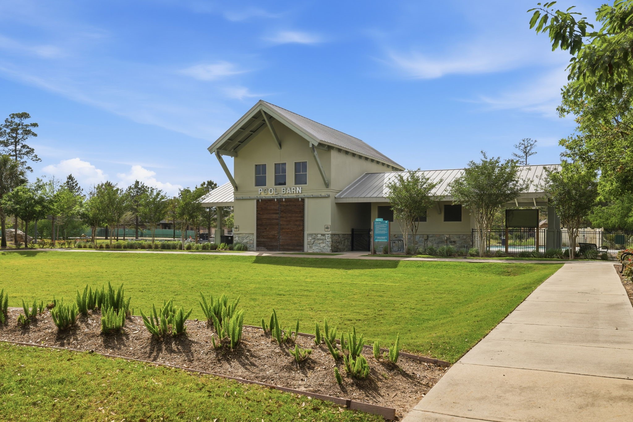 8169 Tranquil Lake Way Conroe, TX 77385 - Photo 21 of 26 a front view of a house with garden