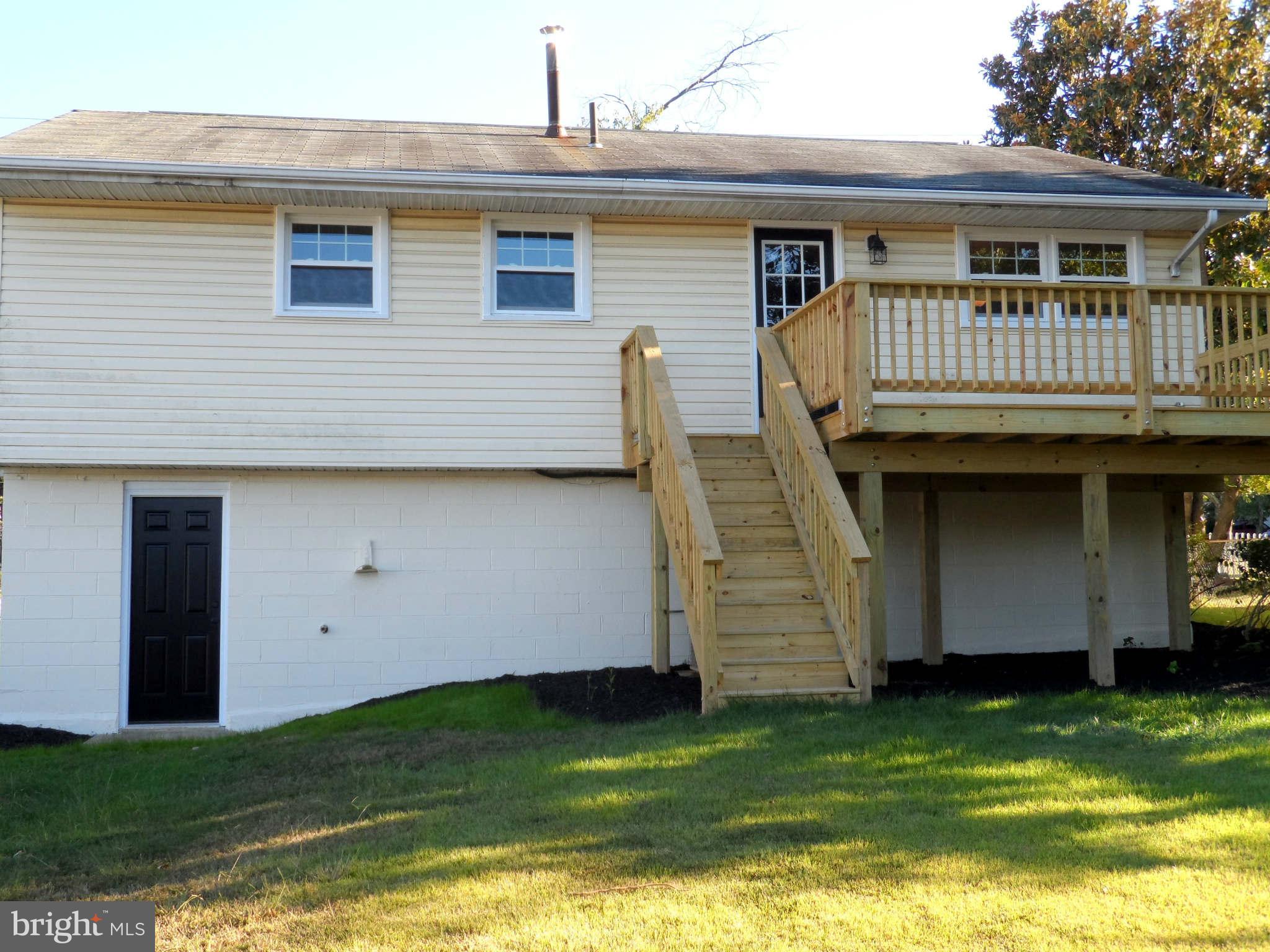5704 Westgate Road Lanham, MD 20706 - Photo 22 of 25 a front view of a house with a yard