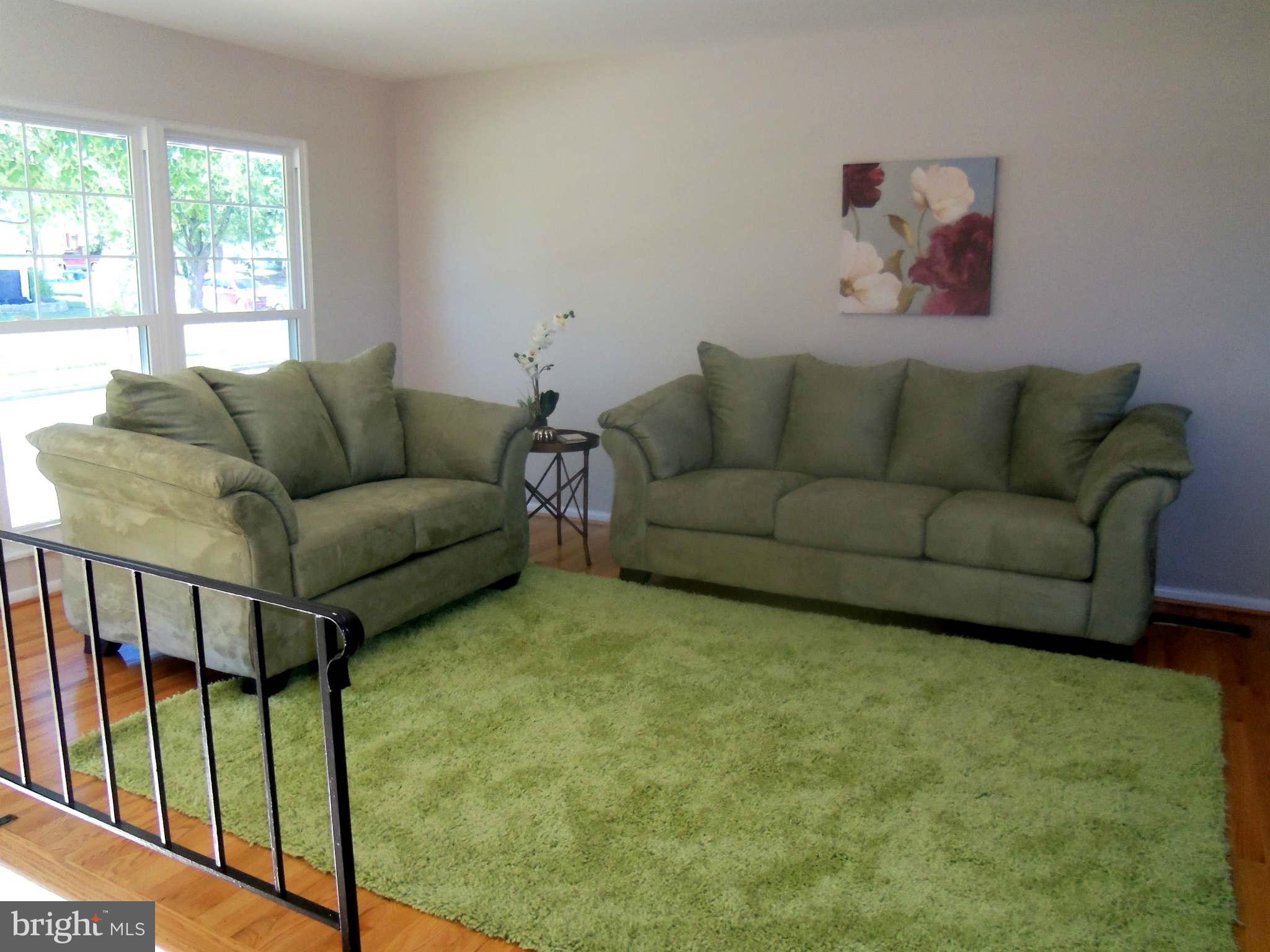 5704 Westgate Road Lanham, MD 20706 - Photo 5 of 25 a living room with furniture and a window