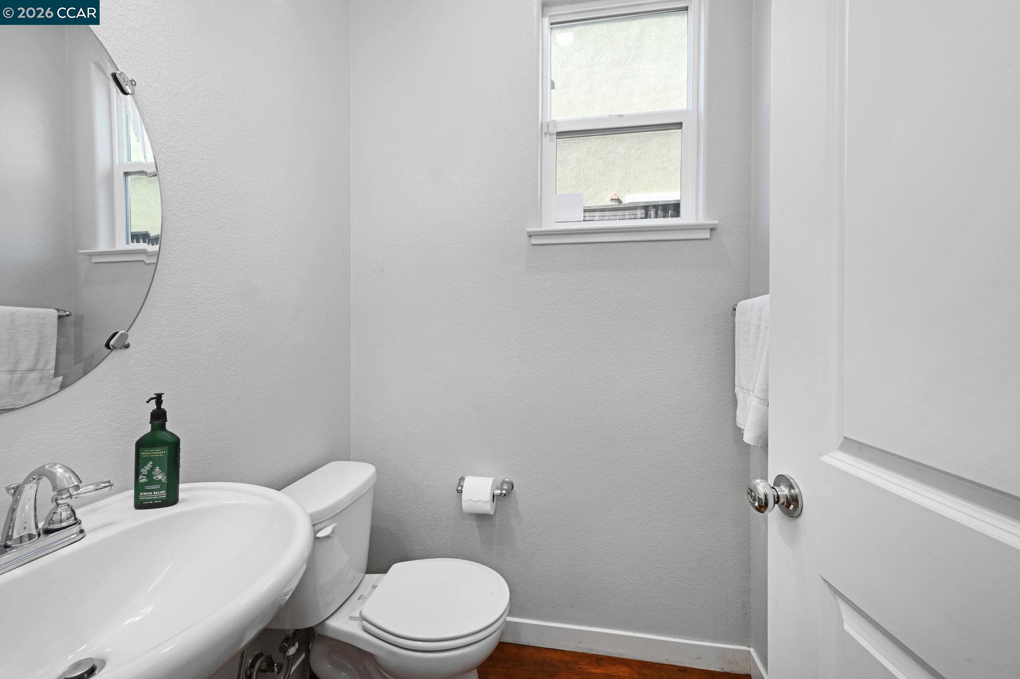 130 Savona Way Bay Point, CA 94565 - Photo 14 of 41 a white toilet sitting next to a bathroom sink