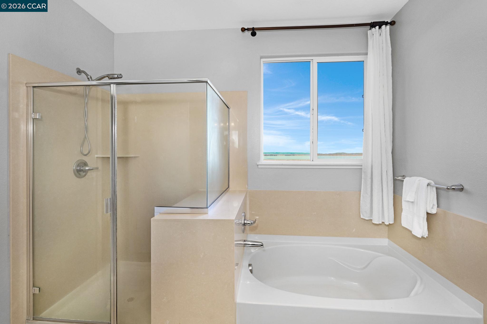 130 Savona Way Bay Point, CA 94565 - Photo 17 of 41 a white bath tub sitting next to a window