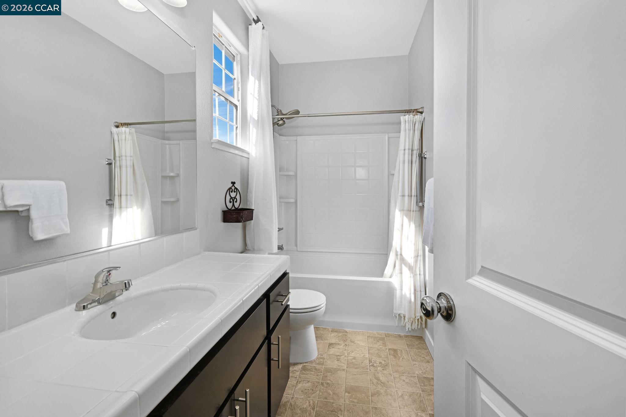 130 Savona Way Bay Point, CA 94565 - Photo 22 of 41 a bathroom with a sink a toilet and a tub