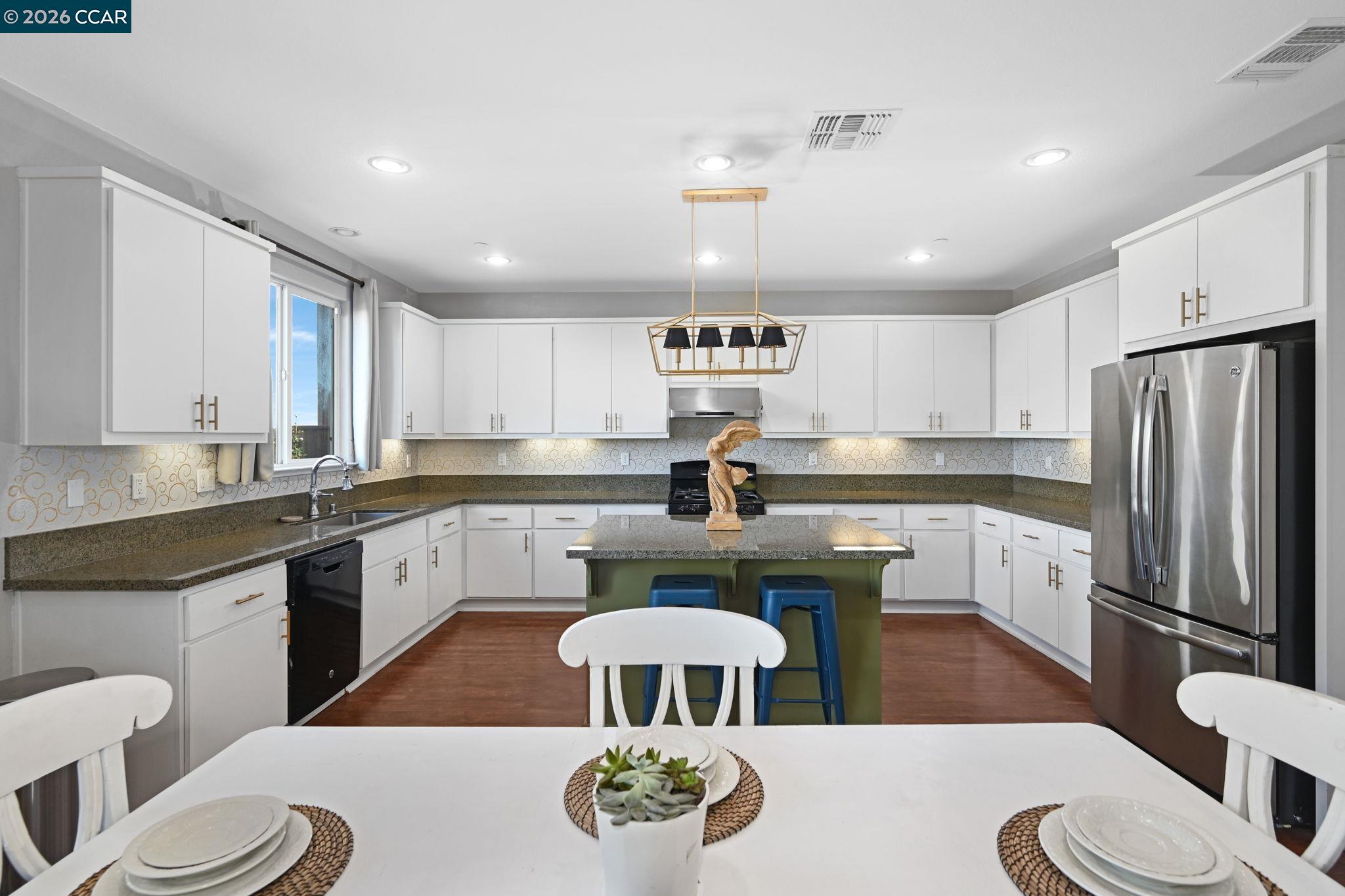 130 Savona Way Bay Point, CA 94565 - Photo 10 of 41 a kitchen with a sink stove and white cabinets