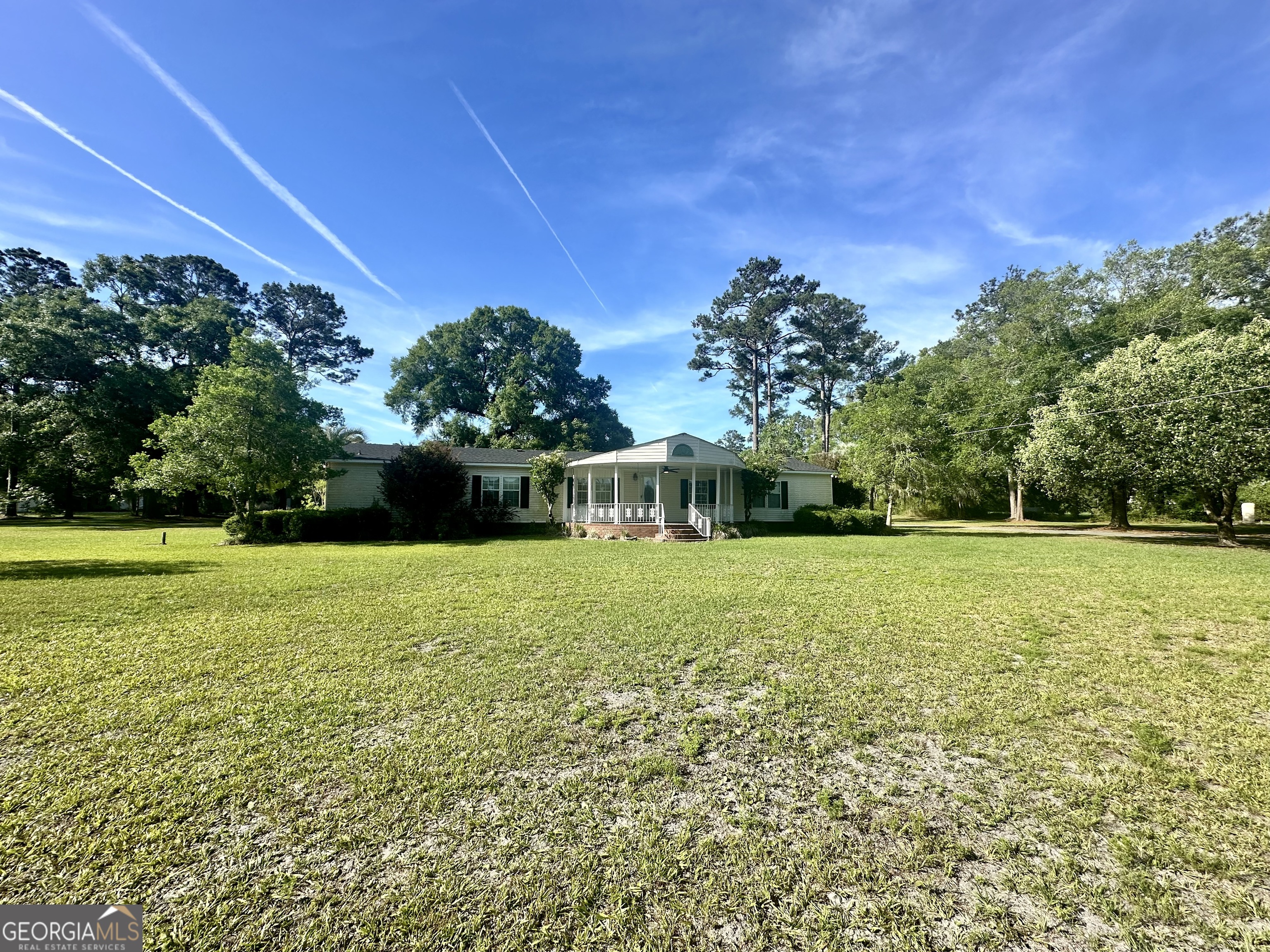 6498 Central Avenue Waycross, GA 31503 - Photo 1 of 20 a view of a house with a yard