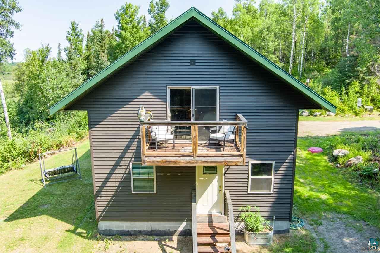 7603 Levander Road Embarrass, MN 55732 - Photo 38 of 51 Dark horizontal siding exterior with a green roofline