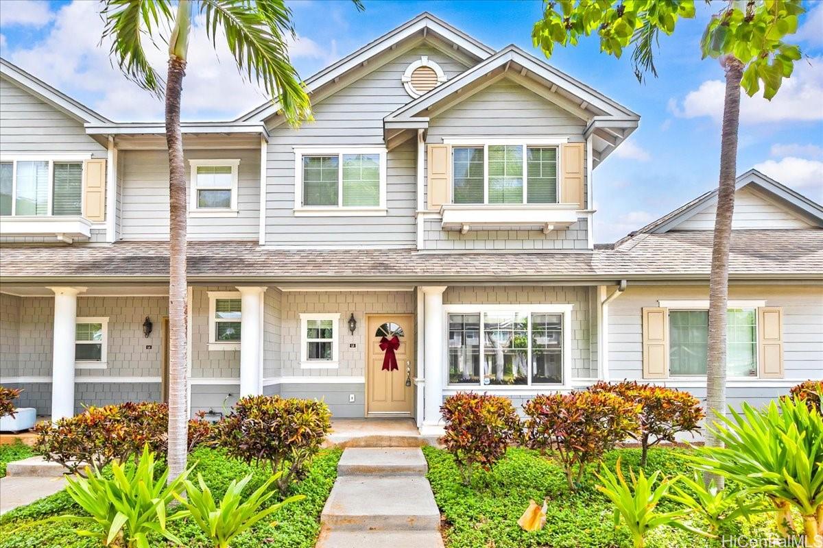 91-1121 Keoneula Boulevard, Unit L5 Ewa Beach, HI 96706 - Photo 1 of 20 a front view of a house with a garden