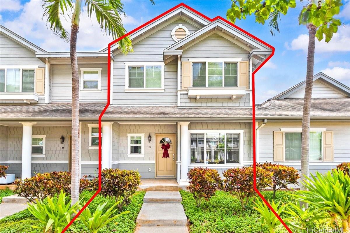 91-1121 Keoneula Boulevard, Unit L5 Ewa Beach, HI 96706 - Photo 19 of 20 a front view of a house with a yard