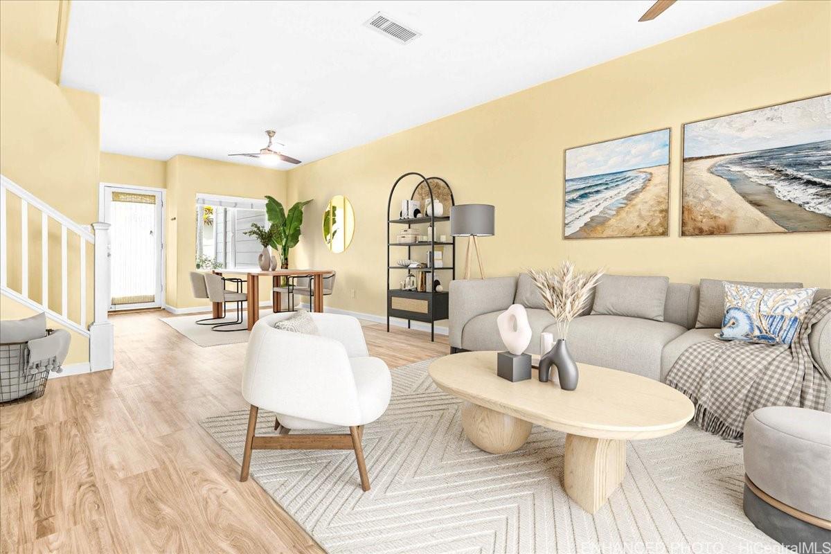 91-1121 Keoneula Boulevard, Unit L5 Ewa Beach, HI 96706 - Photo 2 of 20 a living room with furniture and wooden floor