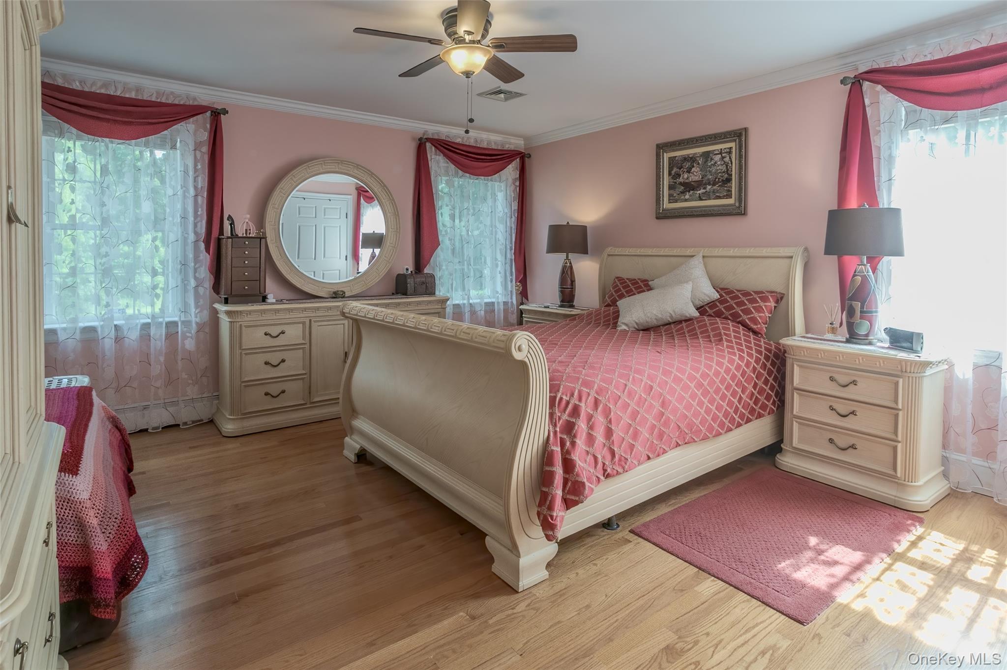 300 Mountain Lodge Road Monroe, NY 10950 - Photo 17 of 41 Bedroom with ornamental molding, light wood-type flooring, multiple windows, and ceiling fan