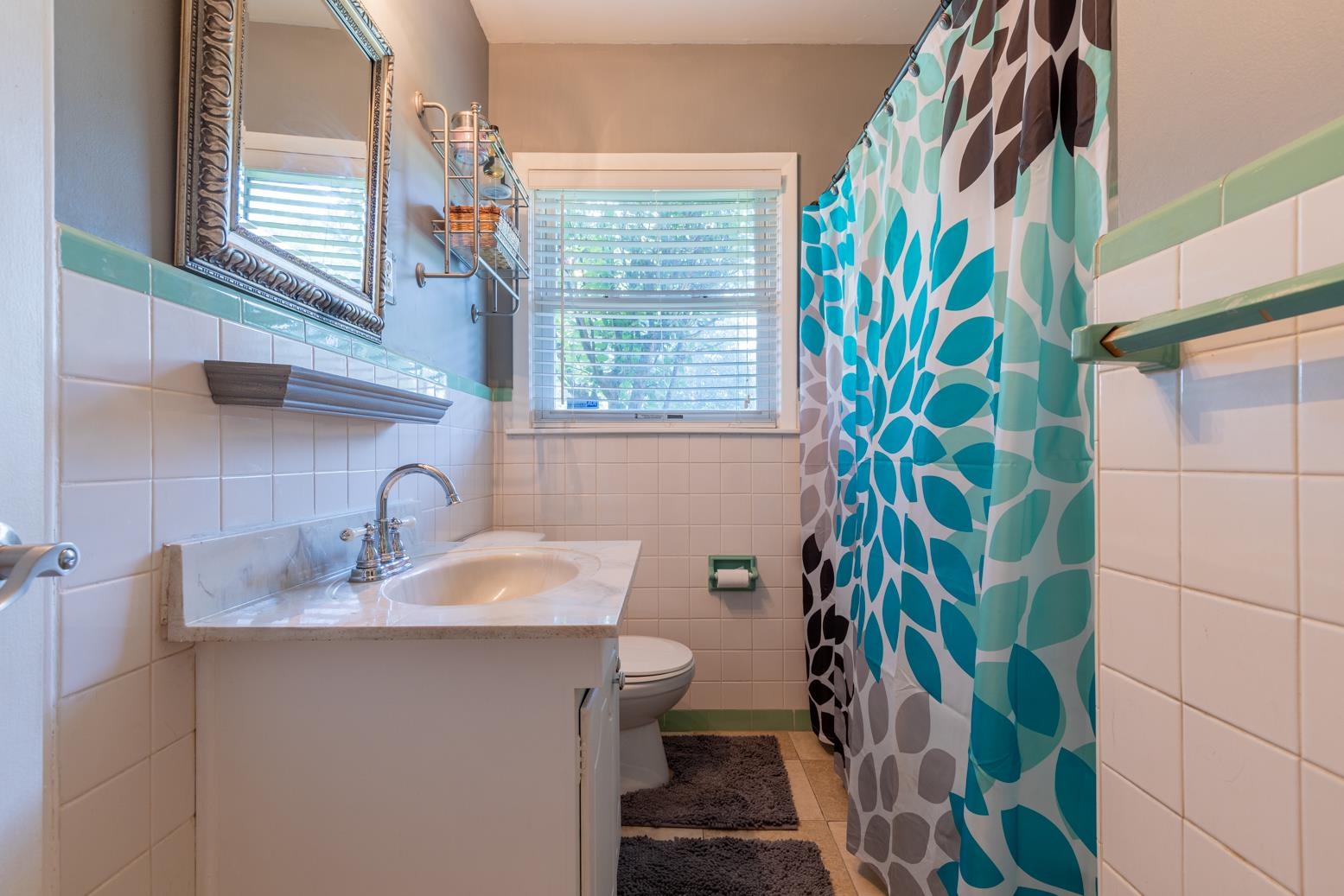 5098 Mason Road Memphis, TN 38117 - Photo 19 of 25 a bathroom with a sink a toilet and a window