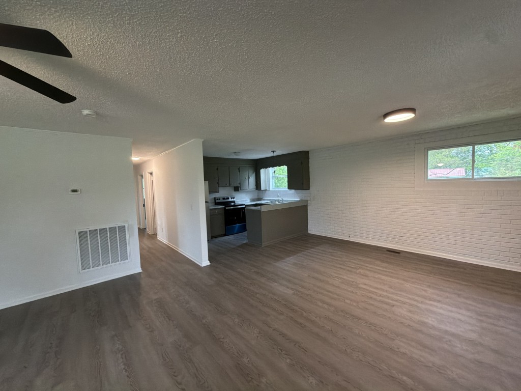 920 Damron Loop Counce, TN 38326 - Photo 7 of 14 a view of kitchen and empty room with wooden floor