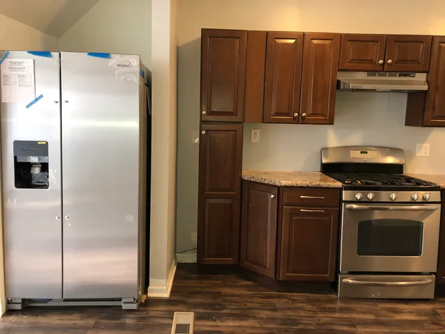 a picture of a room with table and chair