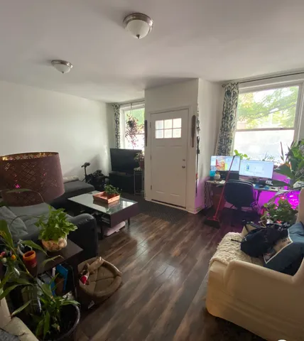 a living room with furniture and a window