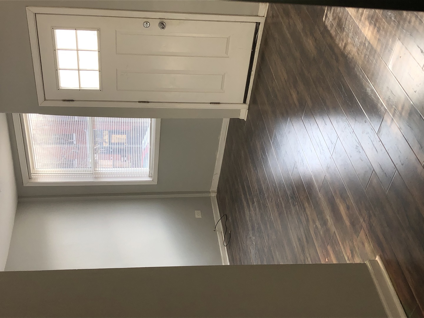 1014 West 19th Street, Unit 1F Chicago, IL 60608 - Photo 3 of 15 a view of an empty room and a window