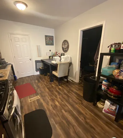 a kitchen with stainless steel appliances granite countertop a stove and a microwave