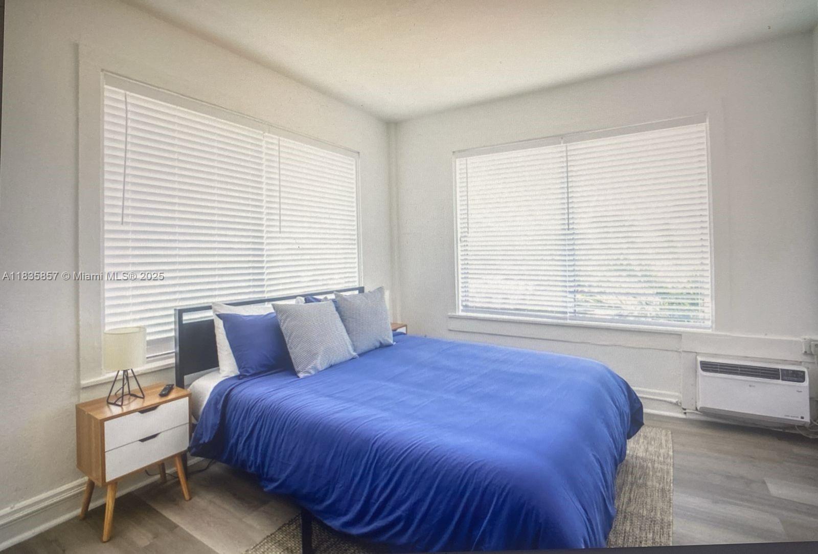 444 Ponce De Leon Boulevard, Unit 12 Coral Gables, FL 33134 - Photo 8 of 14 a bedroom with a bed and window