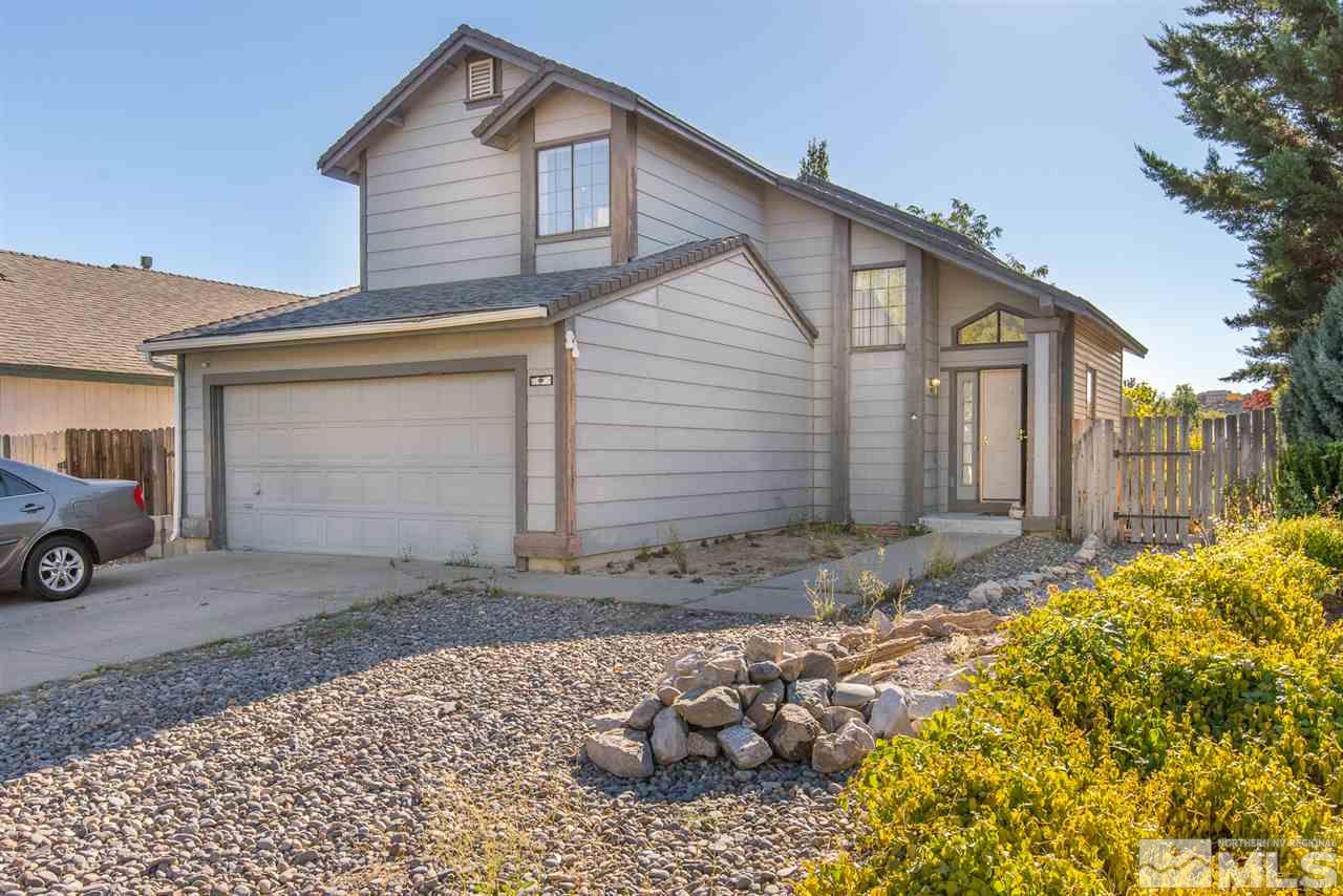 5830 Coyote Ridge Road Reno, NV 89523 - Photo 1 of 16 a view of a house with a yard