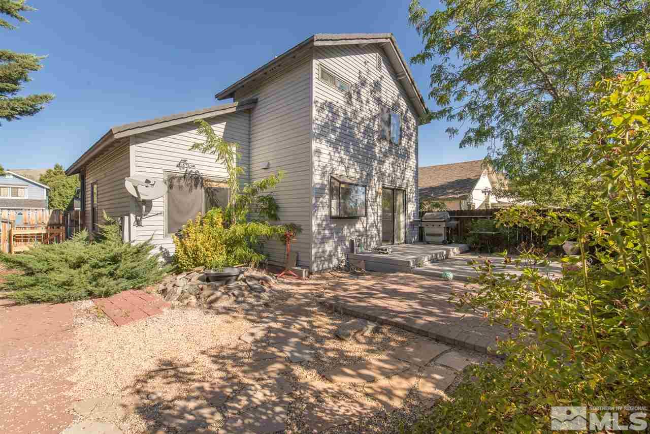 5830 Coyote Ridge Road Reno, NV 89523 - Photo 2 of 16 a view of a house with a yard
