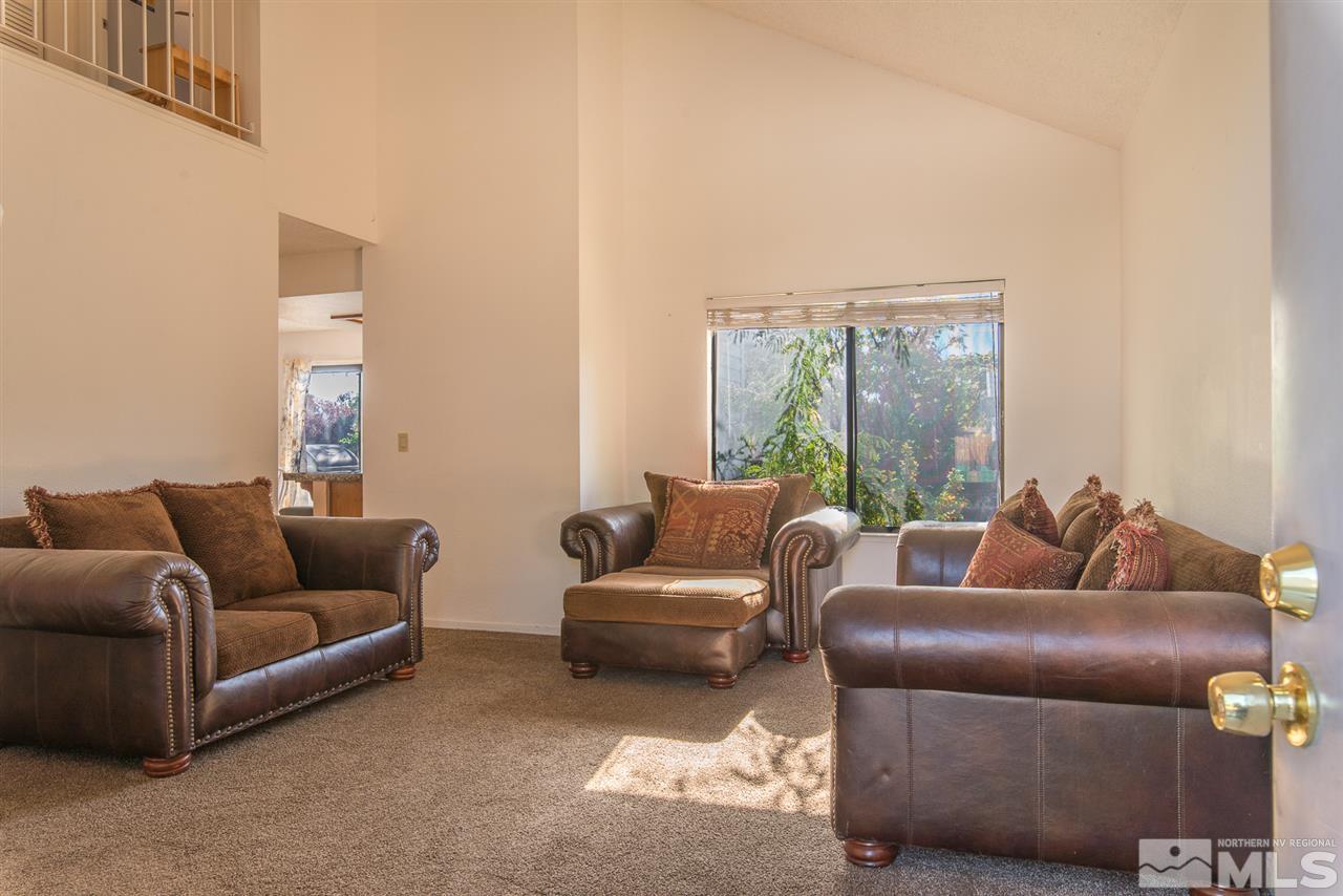 5830 Coyote Ridge Road Reno, NV 89523 - Photo 3 of 16 a living room with furniture and a window