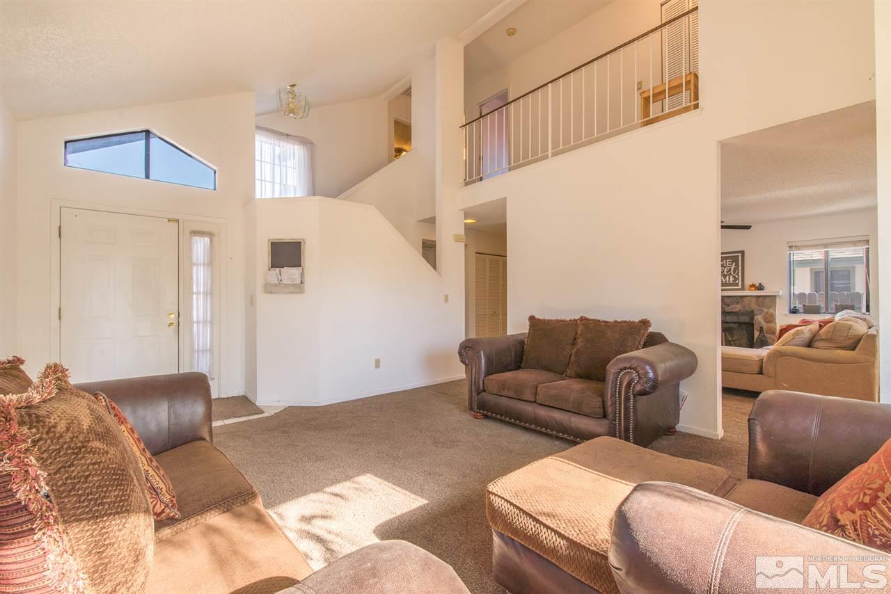 5830 Coyote Ridge Road Reno, NV 89523 - Photo 4 of 16 a living room with furniture and a ceiling fan