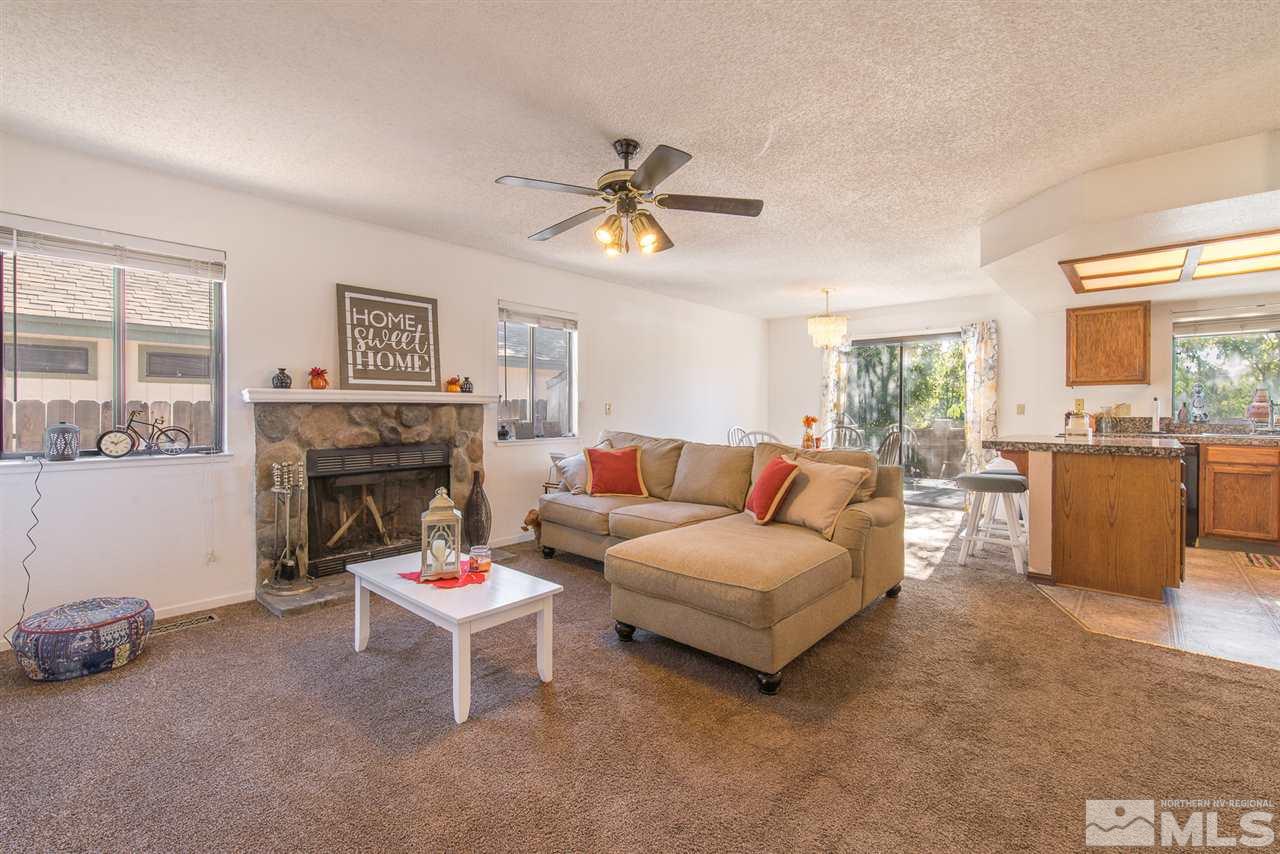 5830 Coyote Ridge Road Reno, NV 89523 - Photo 5 of 16 a living room with furniture and a fireplace
