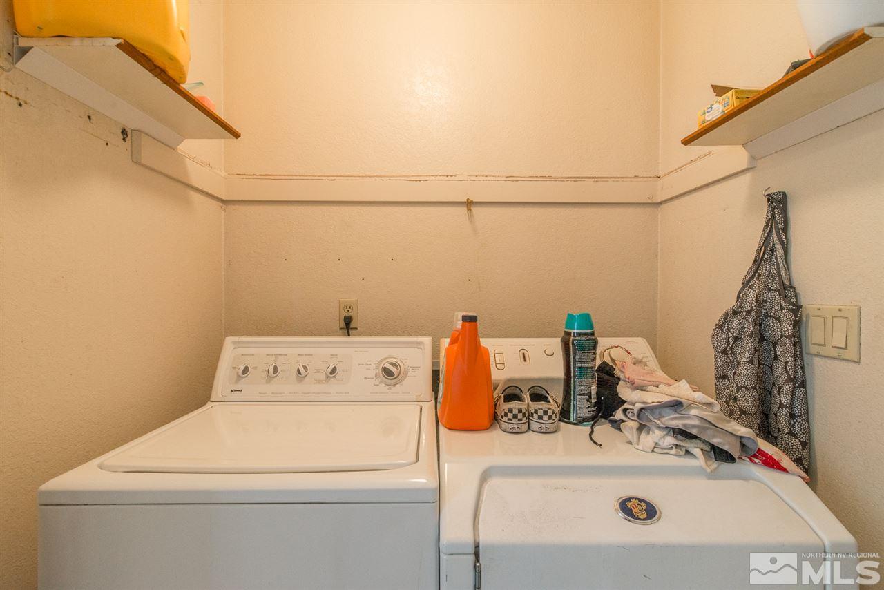 5830 Coyote Ridge Road Reno, NV 89523 - Photo 9 of 16 a utility room with dryer and washer